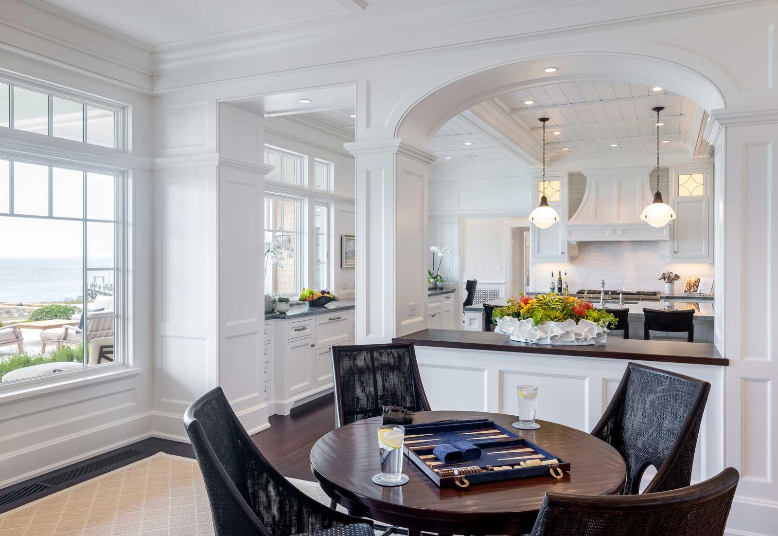Shingle Style Ocean Home - dining area and kitchen by Howland Company Inc.